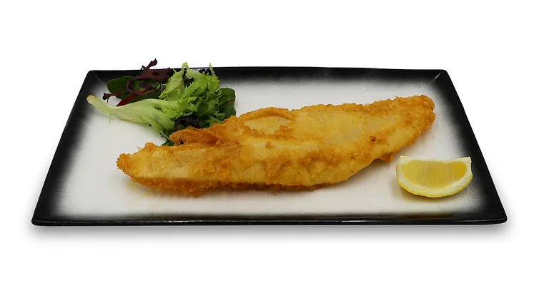 Battered gummy shark flake served with salad and lemon at Captain Kitchen