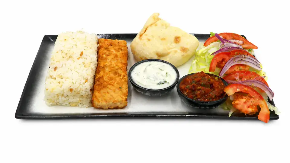 Fish Platter with salmon, rice, bread, mixed salads and dips at Captain Kitchen